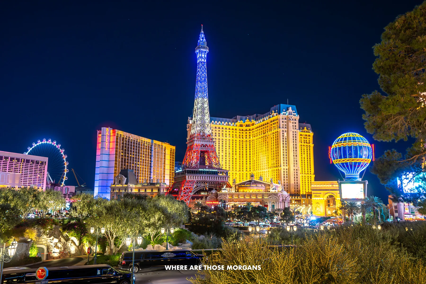 The Las Vegas Strip lit up at night with the Eiffel Tower and Paris hotel prominent