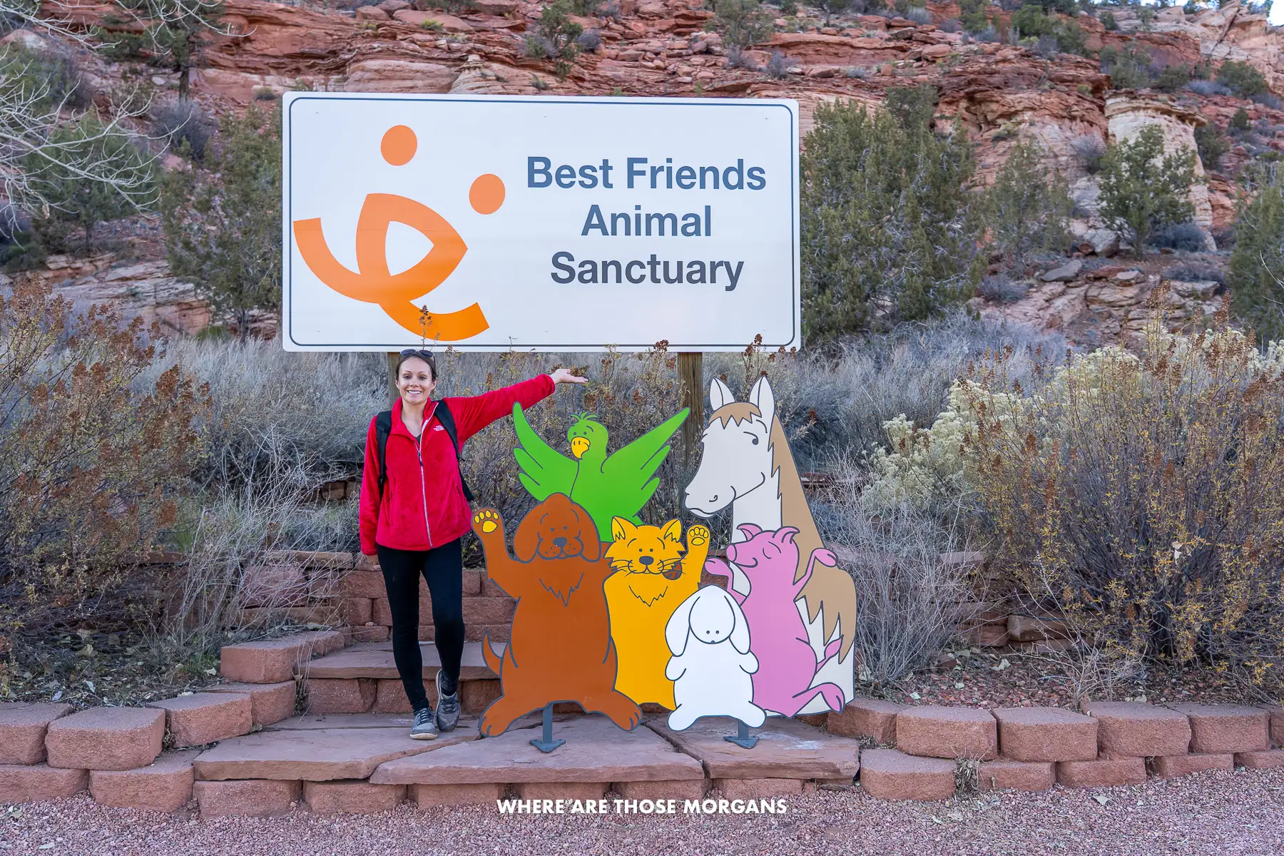 Kristen from Where Are Those Morgans with the entrance sign for Best Friends Animal Sanctuary near Kanab