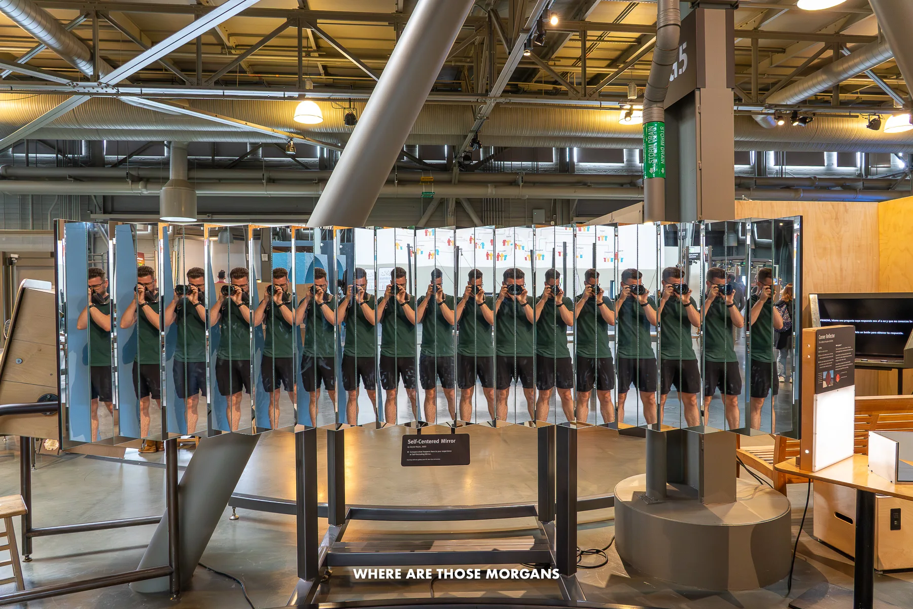 Mark from Where Are Those Morgans taking a reflection photo is a series of mirrors at various angles inside Exploratorium in SF