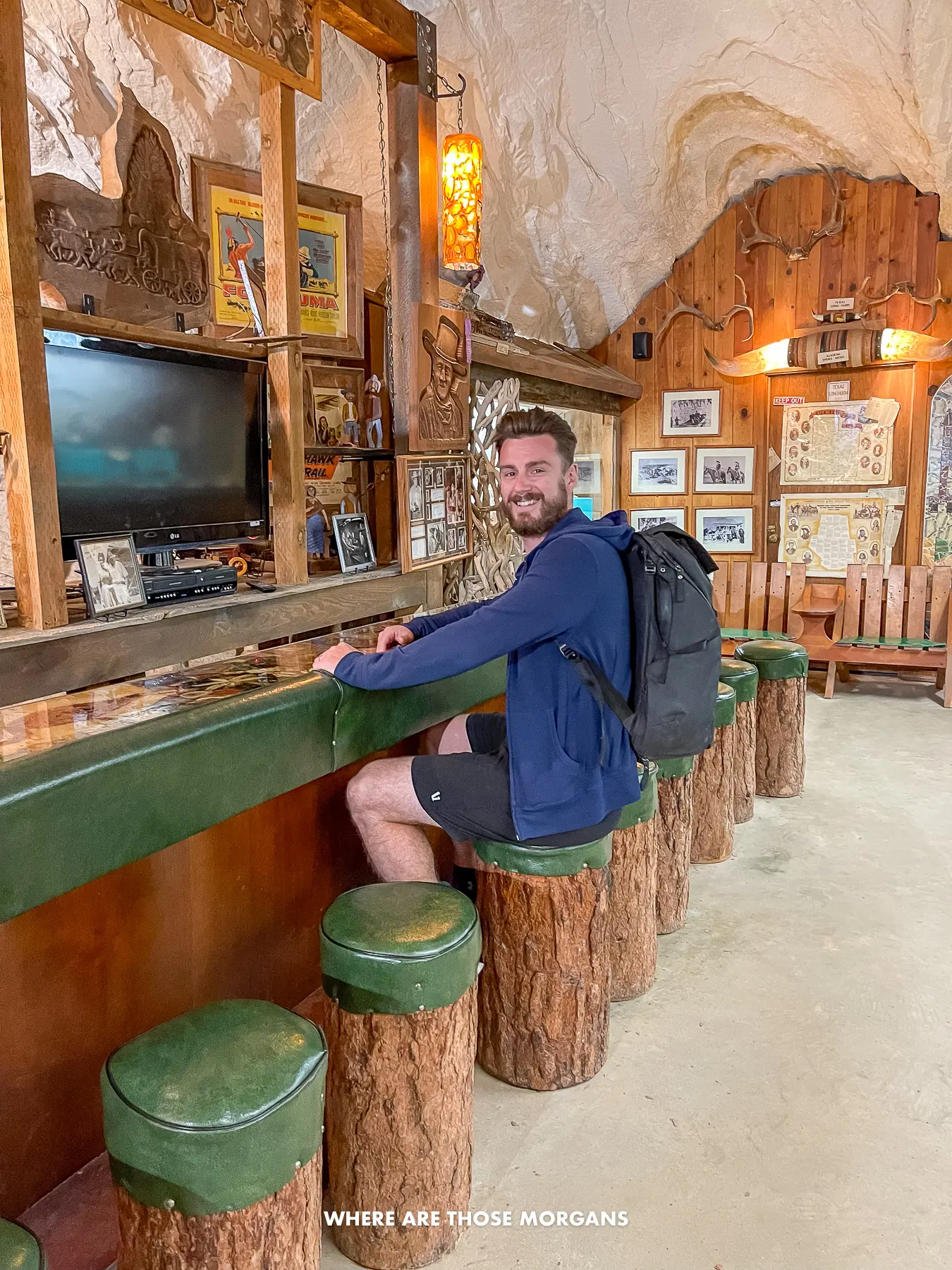 Mark from Where Are Those Morgans sat at a long old bar inside a cave in southern Utah