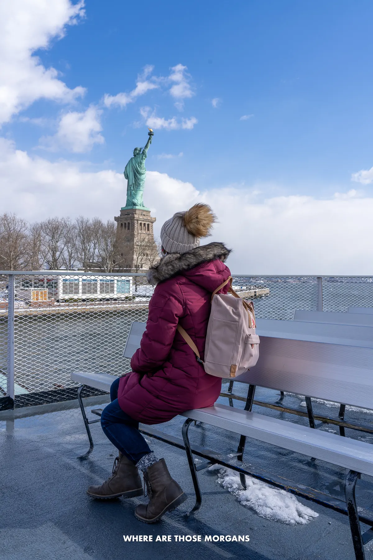 Kristen from Where Are Those Morgans sat on a ferry on the water looking at the back of the Statue of Liberty