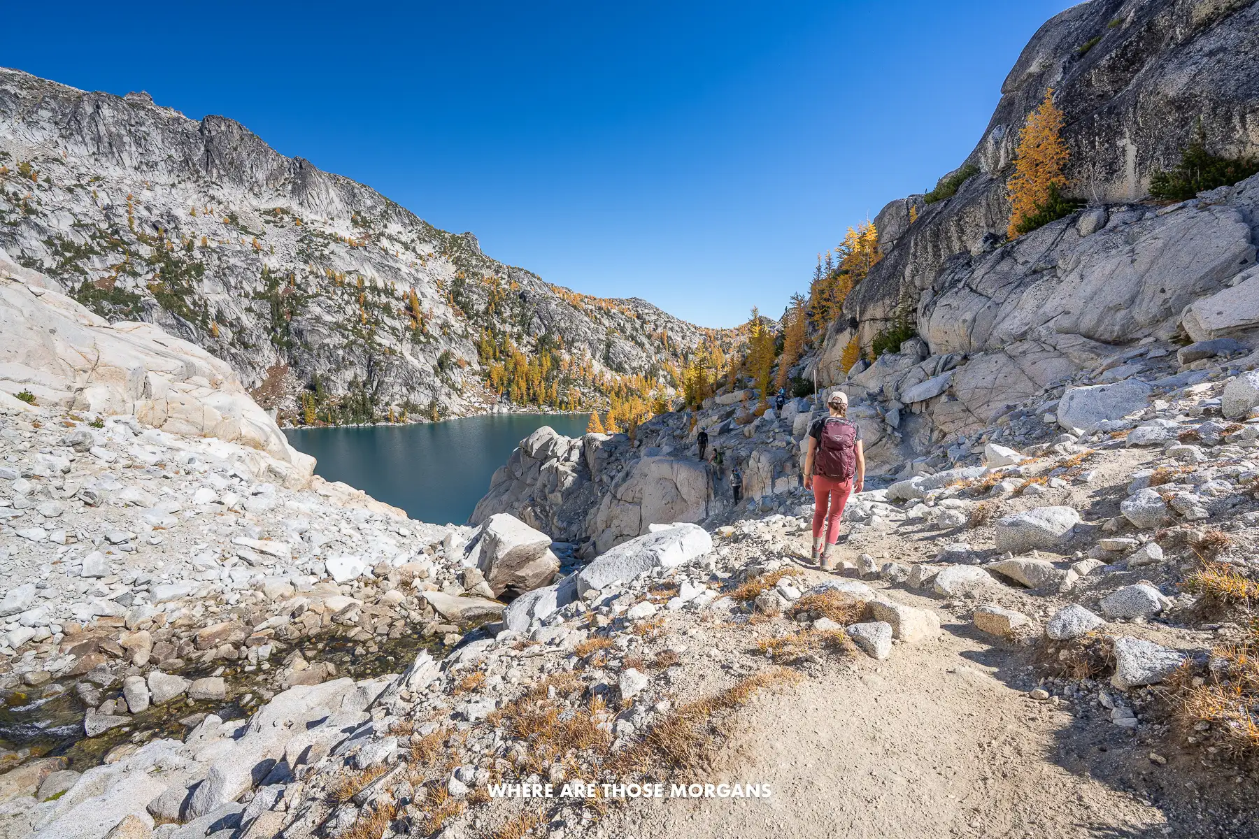 Kristen from Where Are Those Morgans hiking through the Core Enchantments in Washington on a clear sunny day