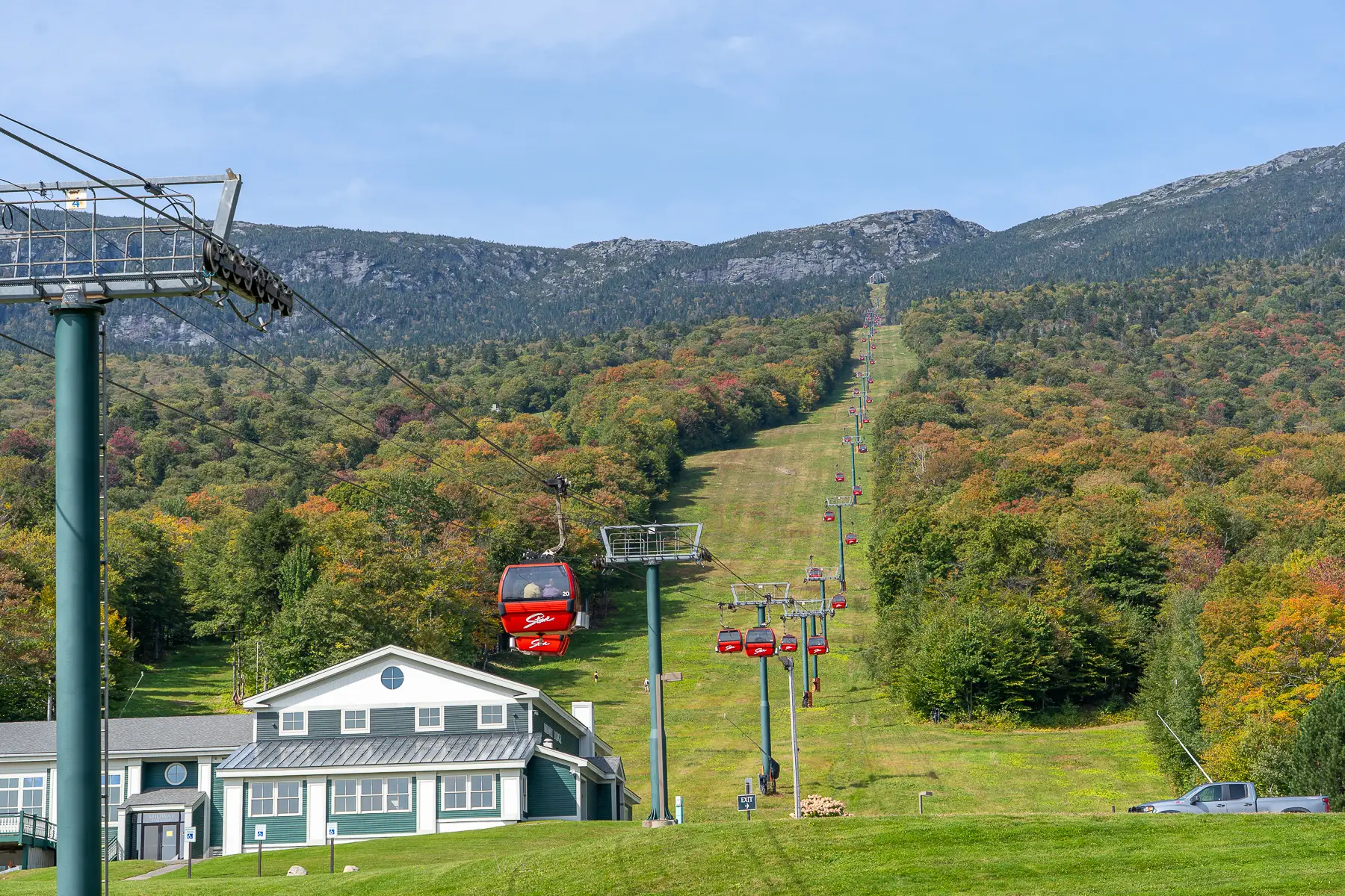 Photo of Stowe gondola ride from the bottom looking all the way up to Mt Mansfield summit on a clear sunny day