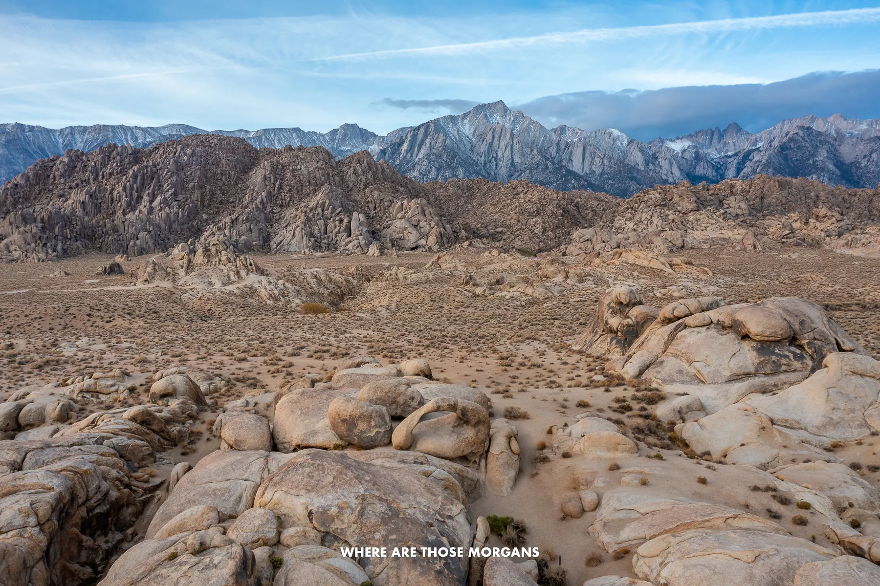 Drone photo of the Alabama Hills with Mobius arch in the foreground and Mt Whitney in the background