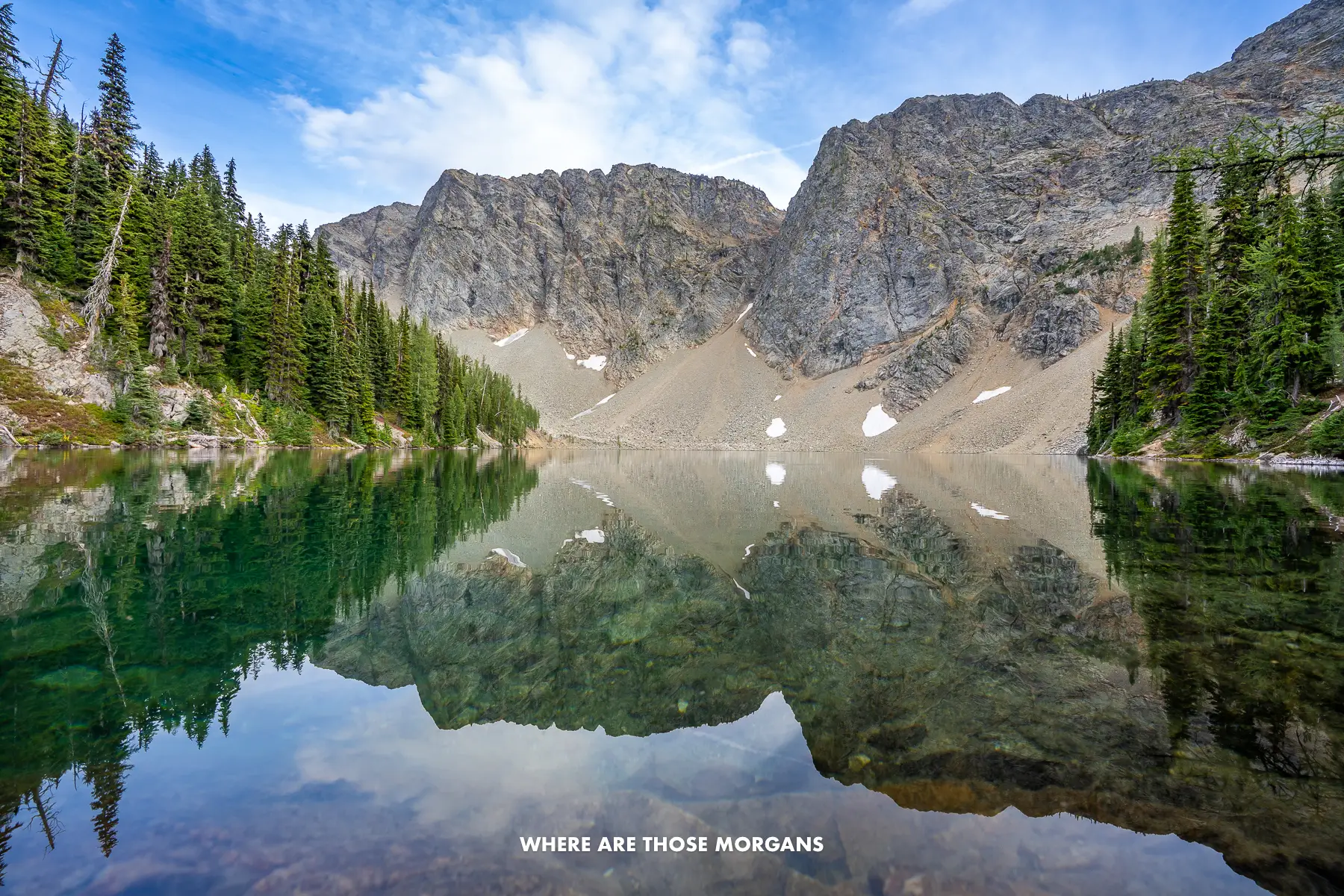 Perfect reflection photo of a lake reflecting trees and mountains at Blue Lake in Washington