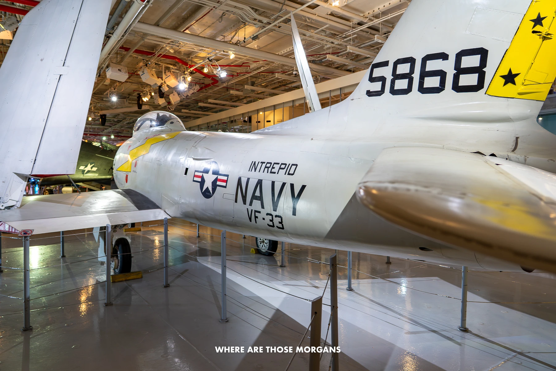 Photo of an old fighter jet inside an aircraft carrier museum