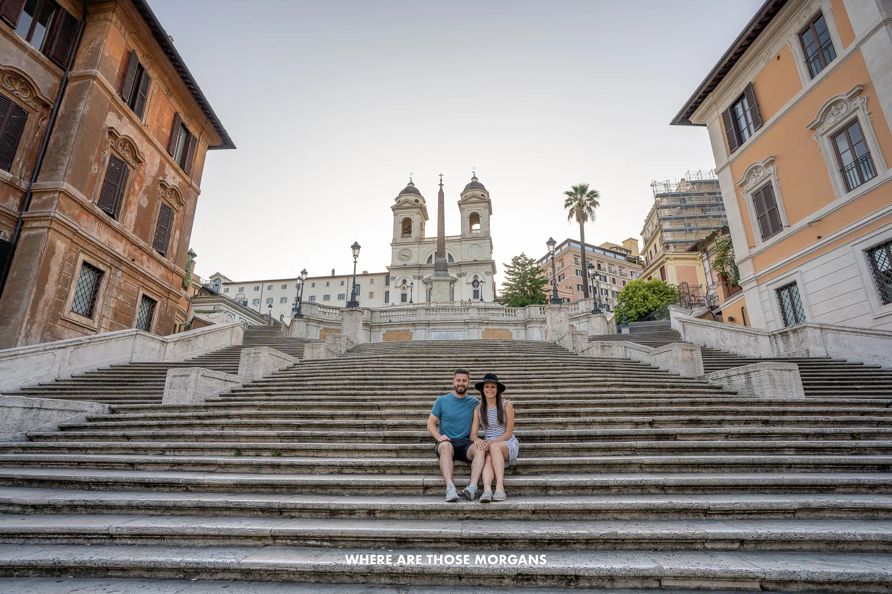 Photo of Mark and Kristen Morgan from Where Are Those Morgans sat on the Spanish Steps in Rome at sunrise with no other people around