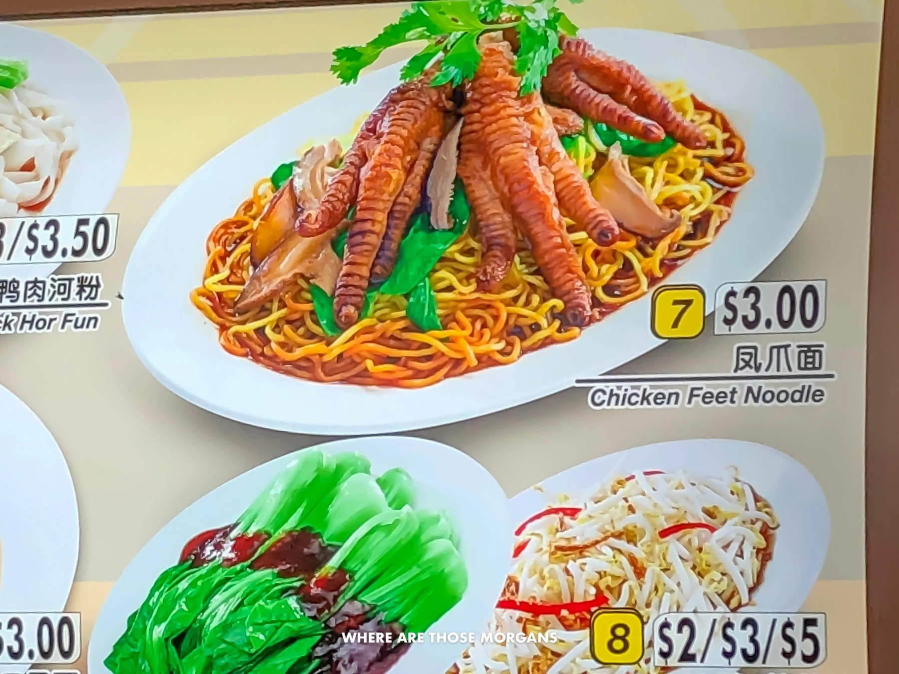 Pictures of food for sale with prices at a hawker centre in Singapore