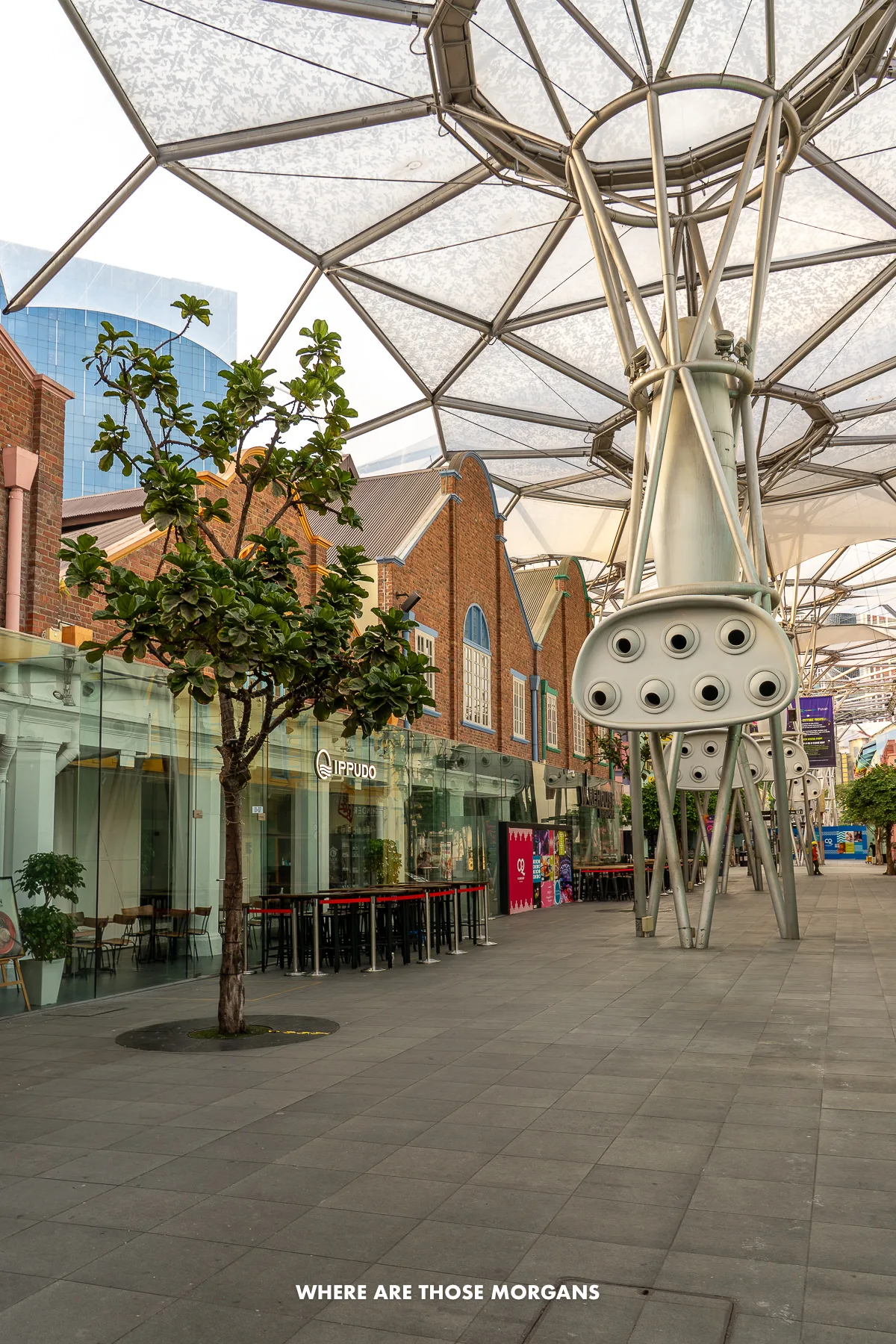 Walking through restaurants and bars under cover of a uniquely designed water protection structure in southeast Asia