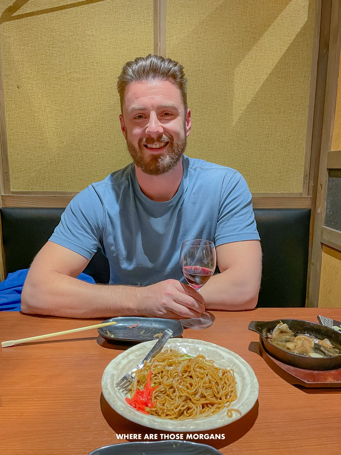 Mark from Where Are Those Morgans eating and drinking in a cubicle in a basement restaurant in Shinjuku