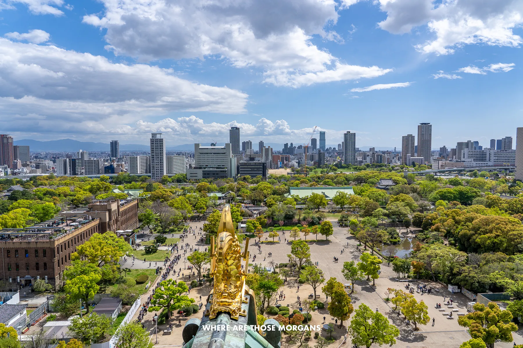 Wide open view over Osaka from the top of Osaka Castle on a sunny day with light clouds