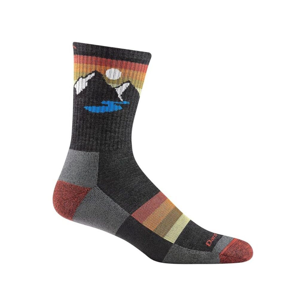 Darn tough hiking sock with a mountain and sun view pictured