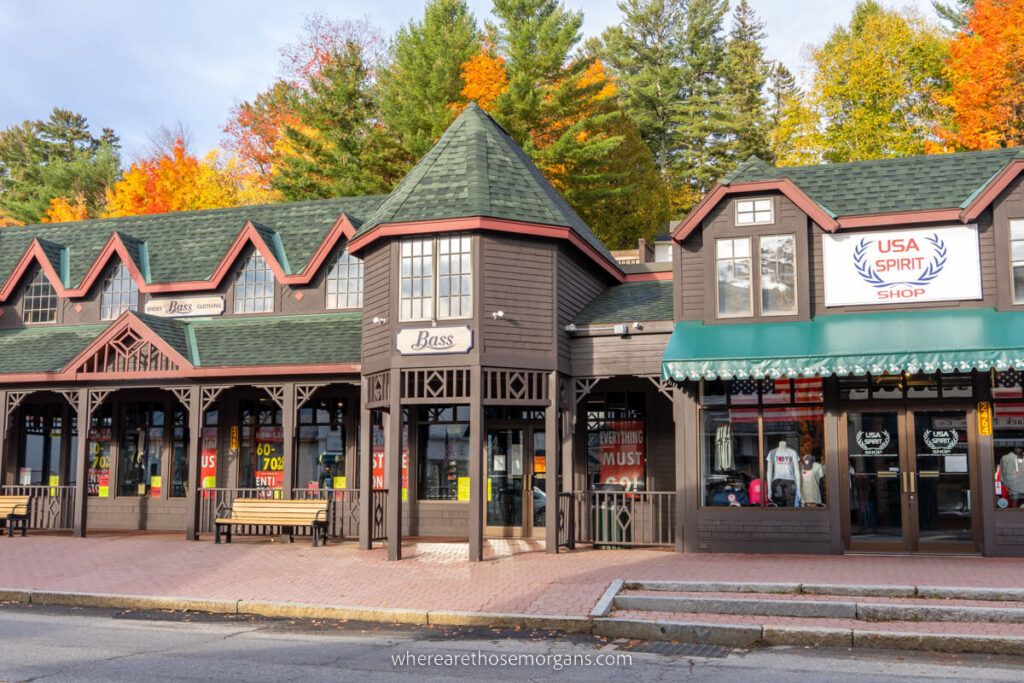 Wooden building facades with colorful trees behind in Adirondacks ny