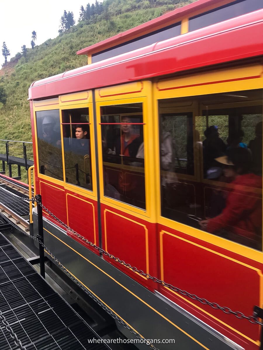 A red car on the Muong Hoa mountain train in Sapa