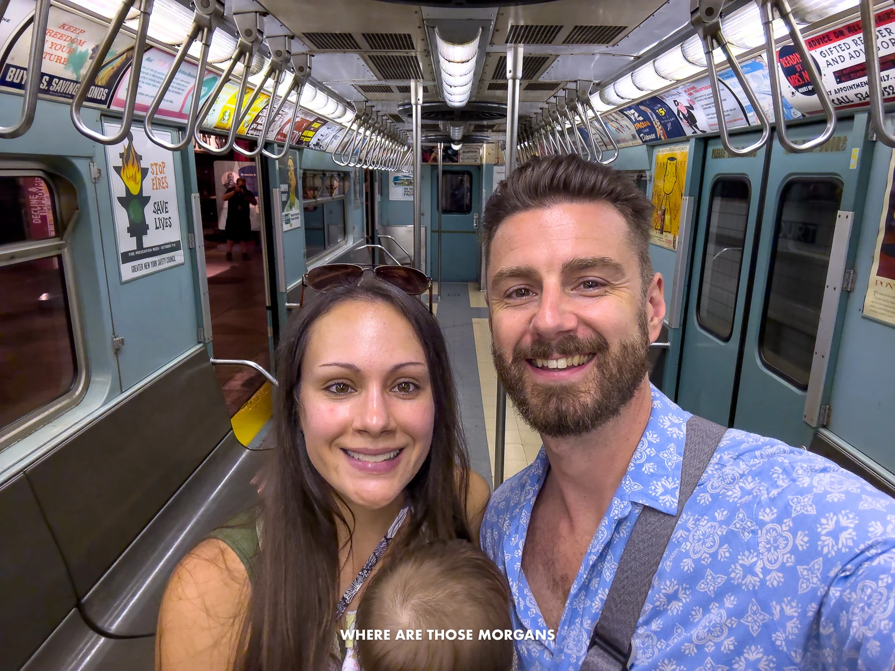 Mark and Kristen from Where Are Those Morgans taking a selfie inside an old subway train in the Transit Museum in NYC