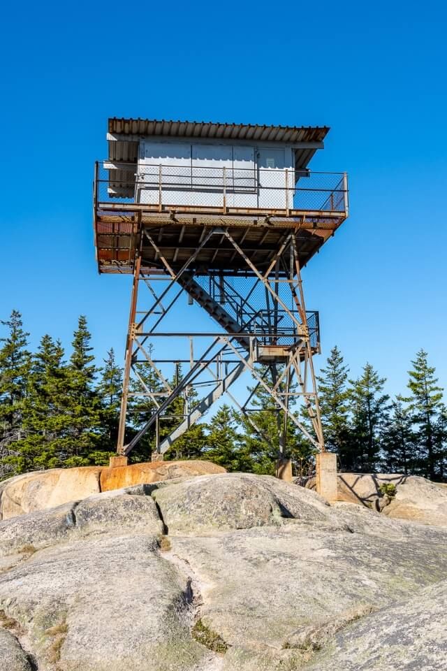 The old and rusty Beach Mountain Fire Tower in Acadia