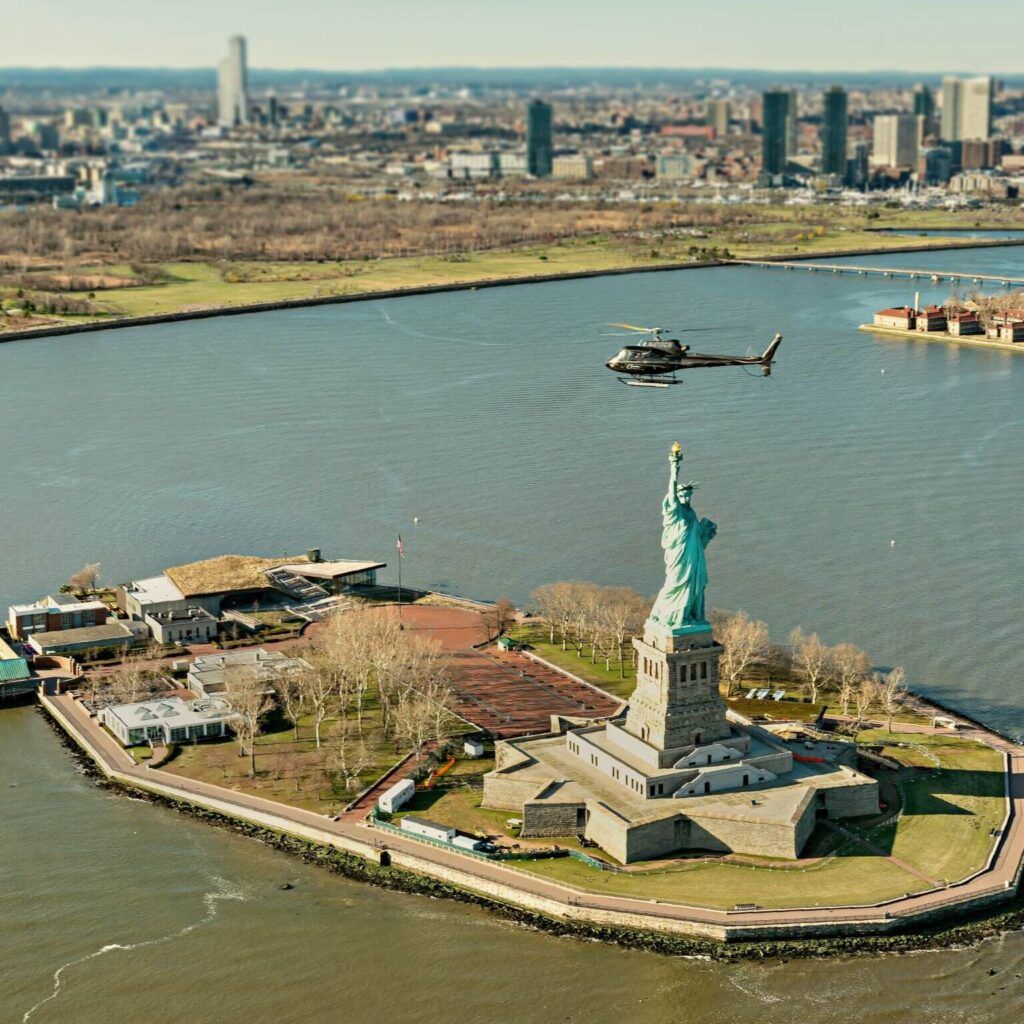 Chopper flying over the Statue of Liberty on Liberty Island