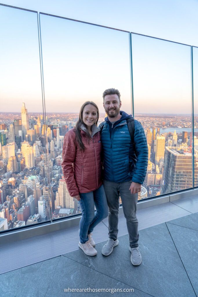 Two people posing for a photo at Edge nyc with New York Sightseeing Pass 