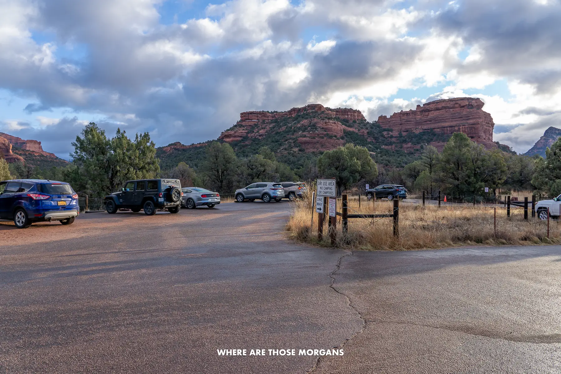 Handful of cars parked in a small and oddly shaped parking lot at Boynton Canyon in Sedona