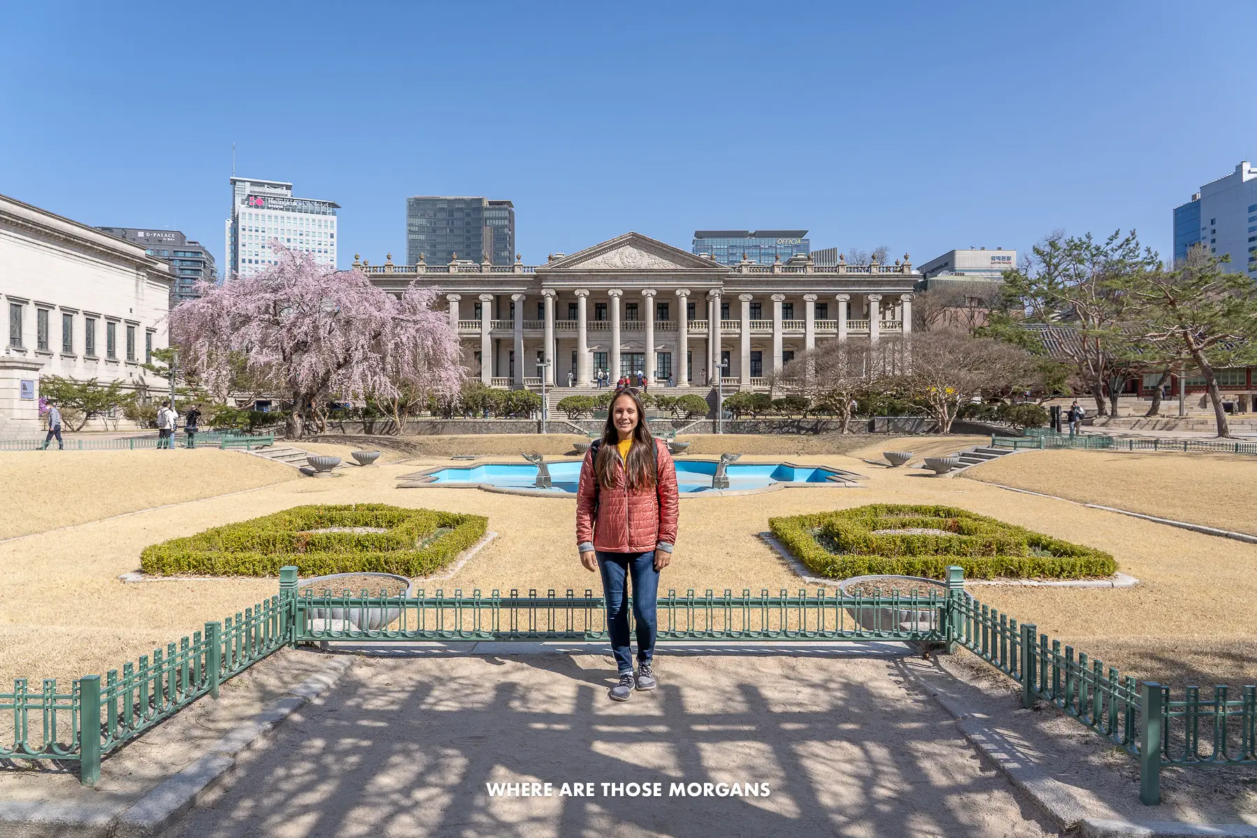 Kristen from Where Are Those Morgans having a photo taken inside Deoksugung Palace in Seoul with European style buildings