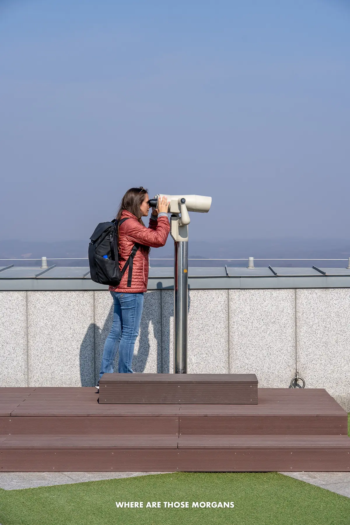 Kristen from Where Are Those Morgans looking through binoculars into North Korea from Dora Observatory