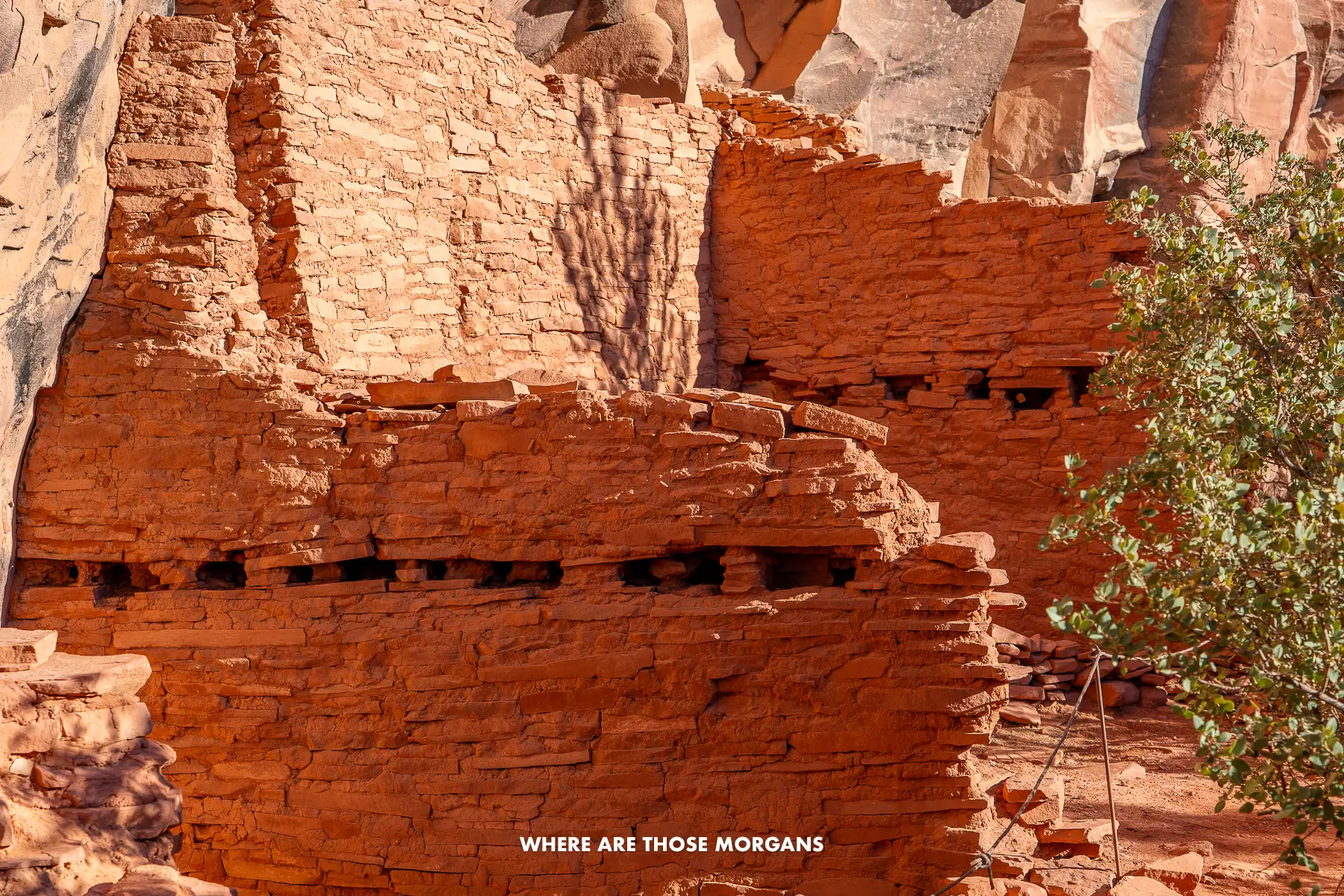 Two old rock dwellings against a cliff in Arizona