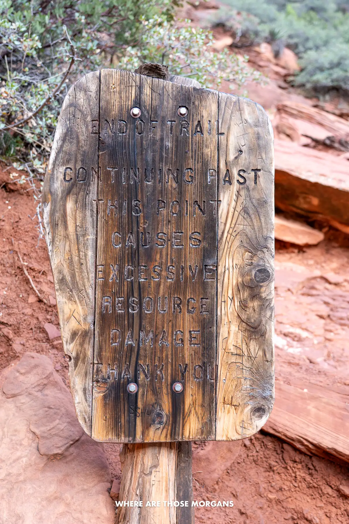 Brown wooden end of trail sign at the summit of Boynton Canyon in Sedona