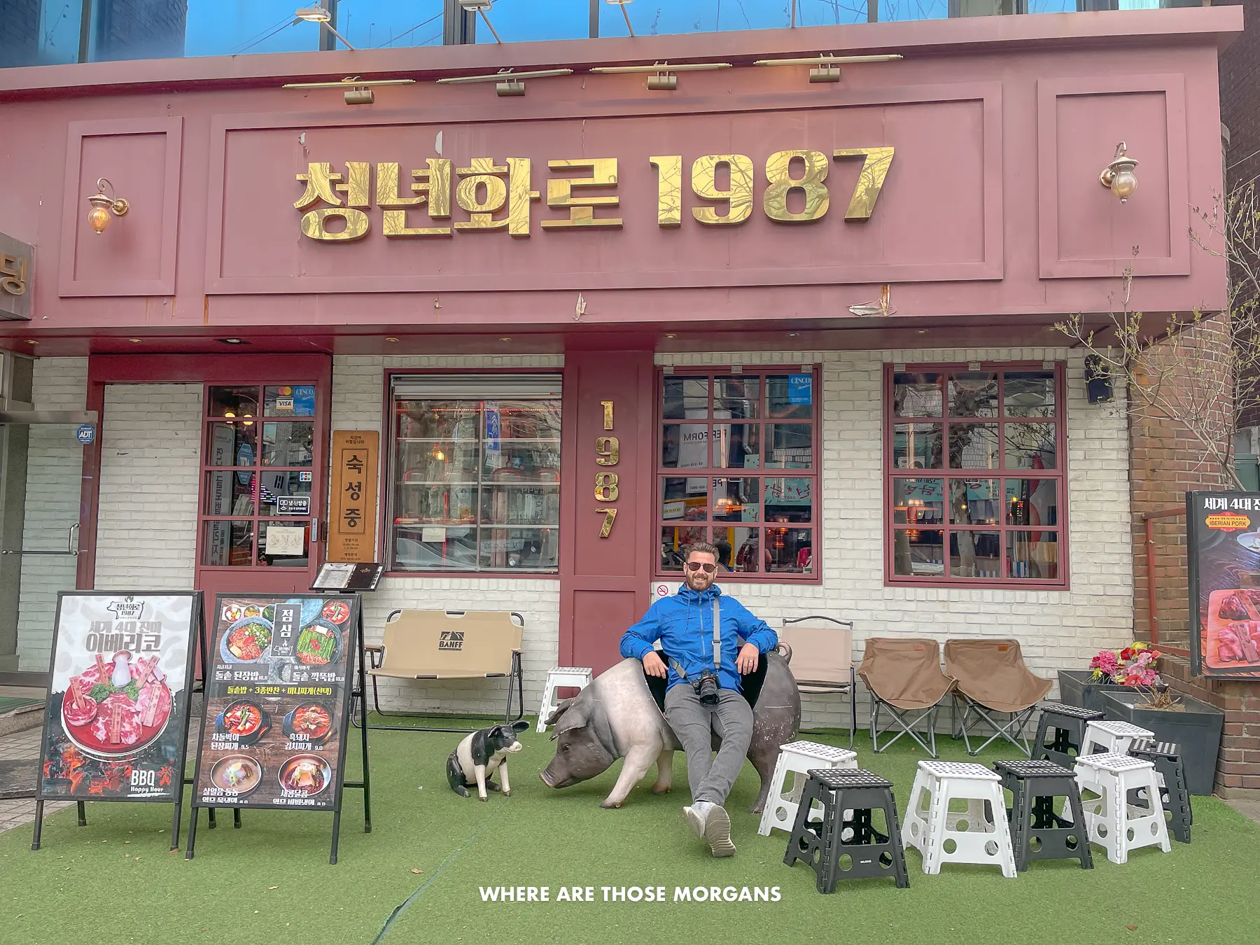 Mark from Where Are Those Morgans sat in a chair outside a Korean BBQ restaurant in Seoul