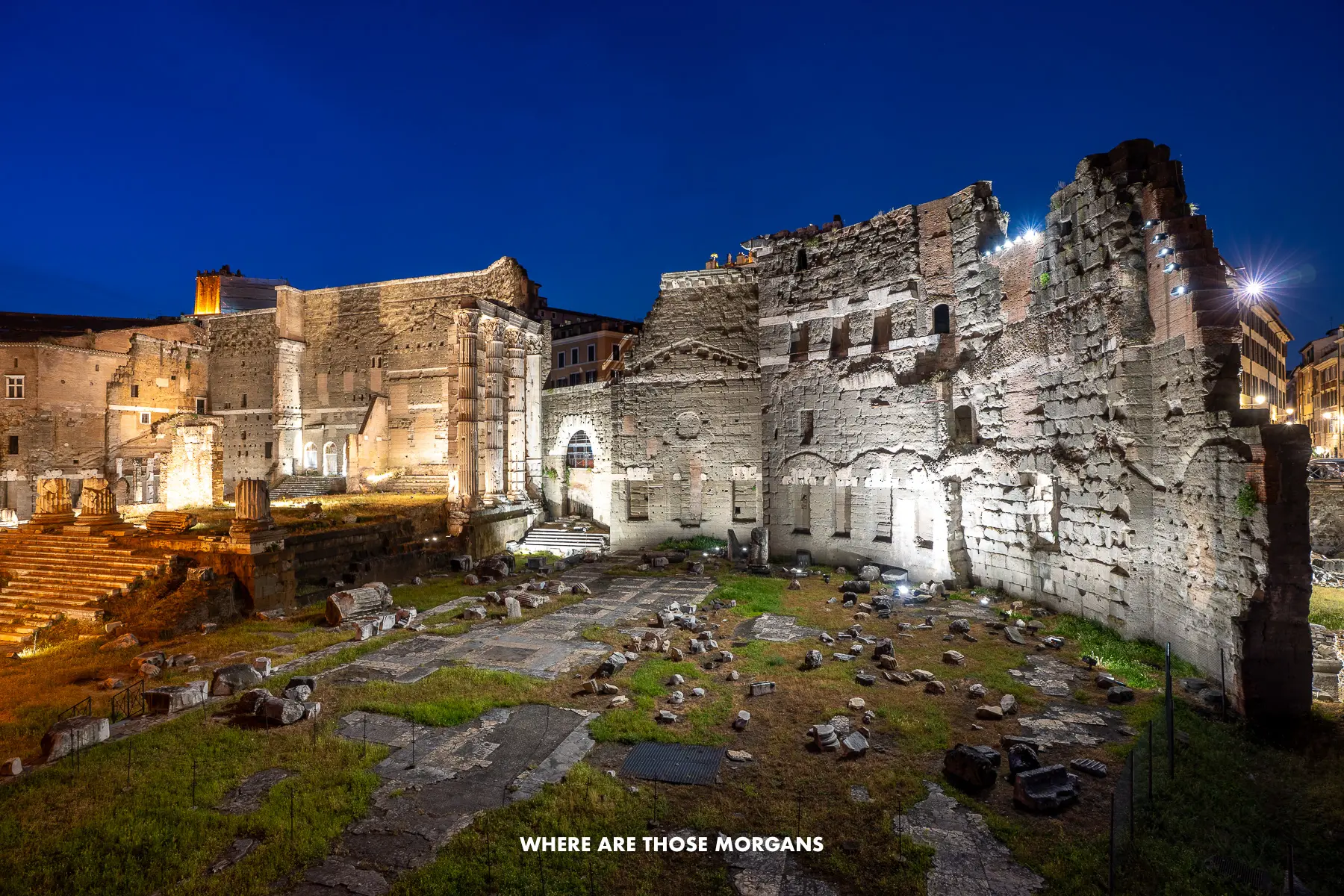 The Foro di Augusto ruins lit up at night