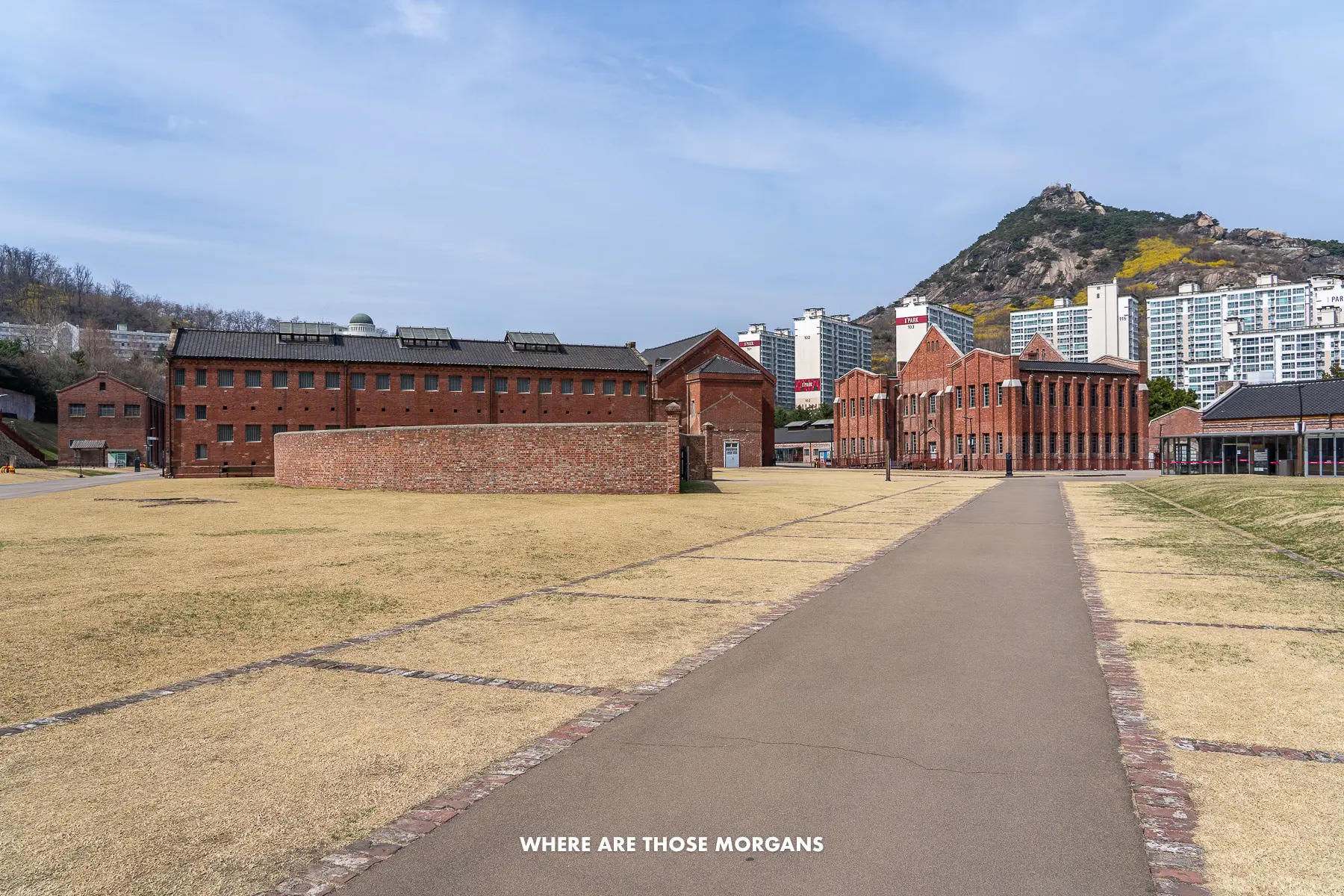 The grounds of Seodaemun Prison in Seoul with a mountain peak in the background