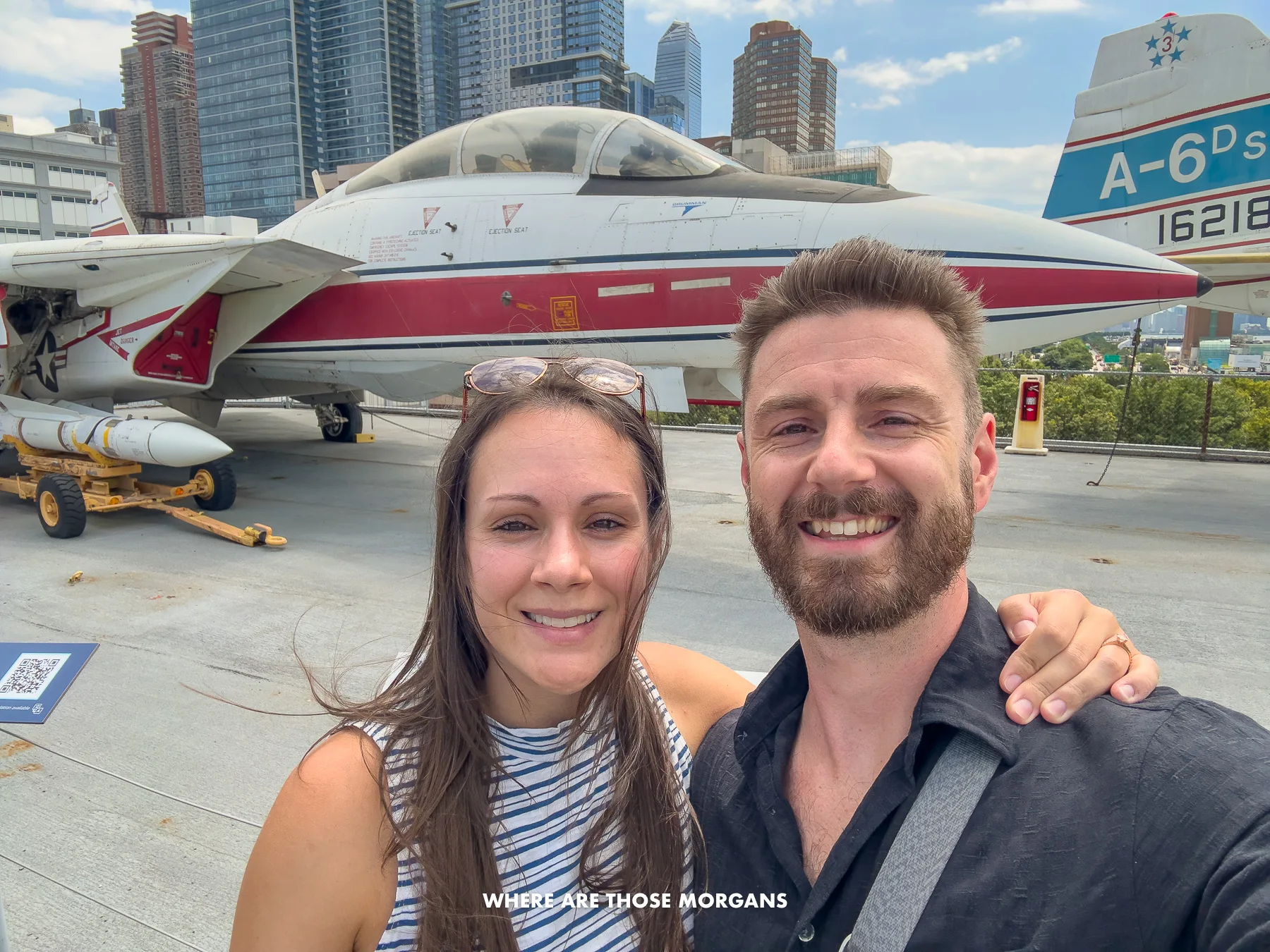 Mark and Kristen from Where Are Those Morgans taking a selfie on the top deck of Intrepid in NYC with a fighter jet behind