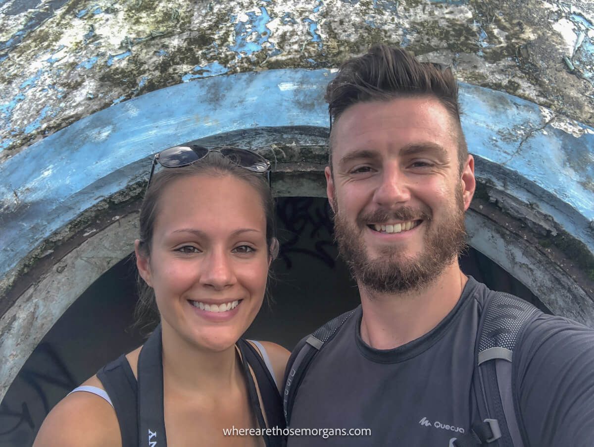 Photo of Where Are Those Morgans taking a selfie in front of an old overgrown water slide in an abandoned waterpark in Hue Vietnam